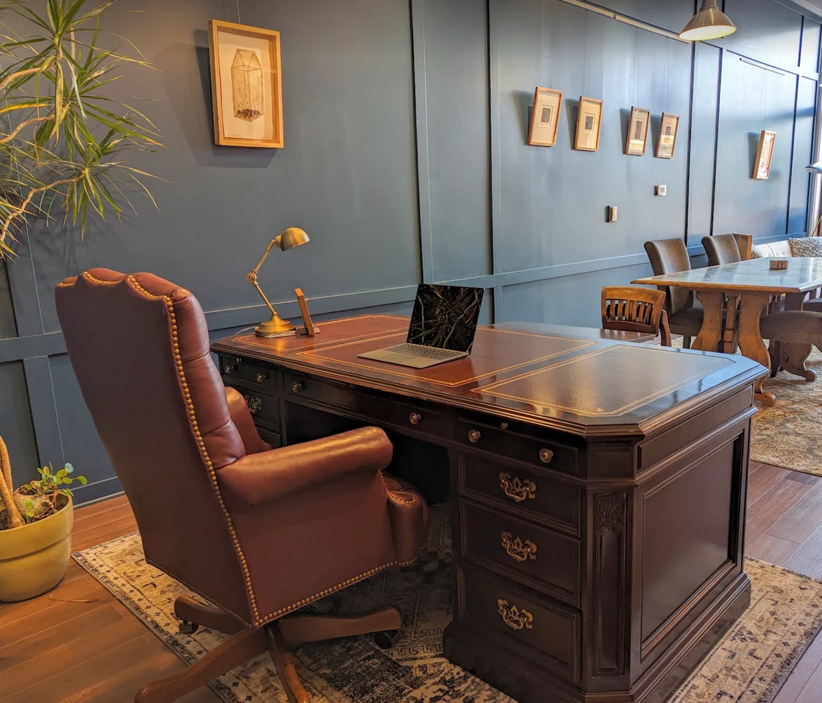 An executive desk and leather chair inside Spacesicle.