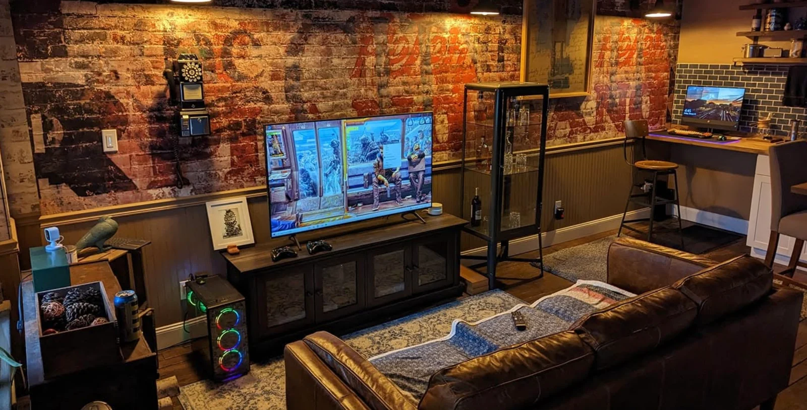 A sofa, television and computer setup in the Spacesicle lounge